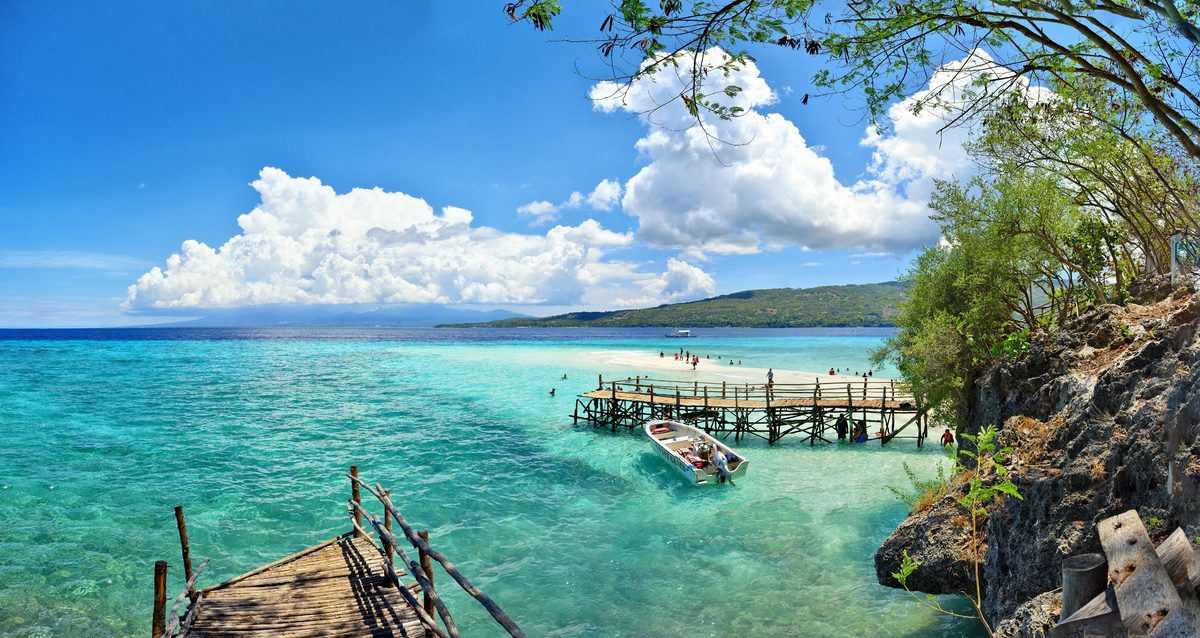 Turquoise water and a wooden pier on a Cebu shoreline Turquoise water and a wooden pier on a Cebu shoreline
